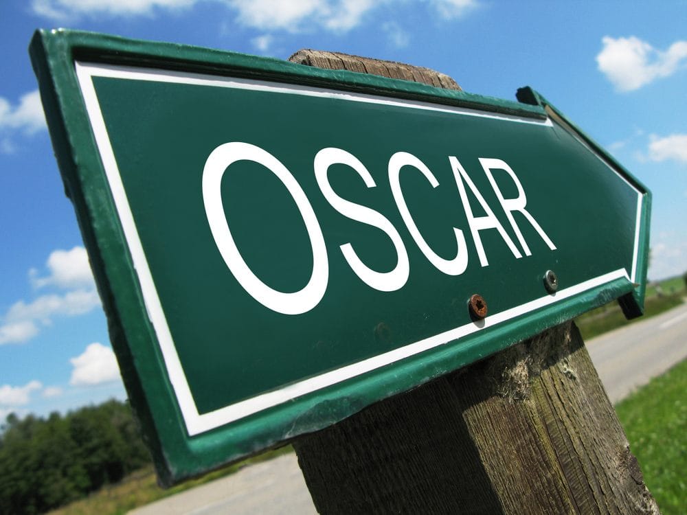 Zeleni znak na putu na kome belim slovima piše OSCAR.